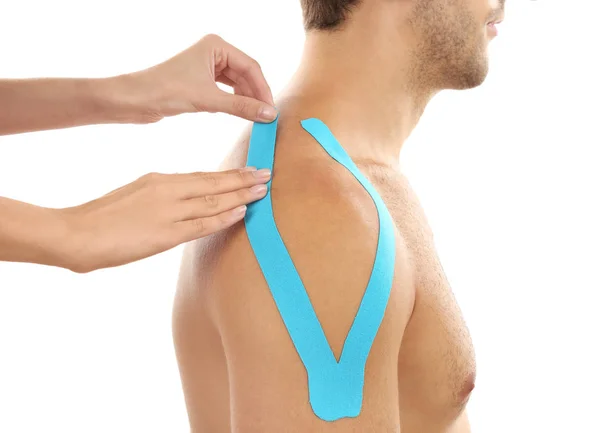 Chiropractic taping with kinesiology tape to support muscles and promote healing